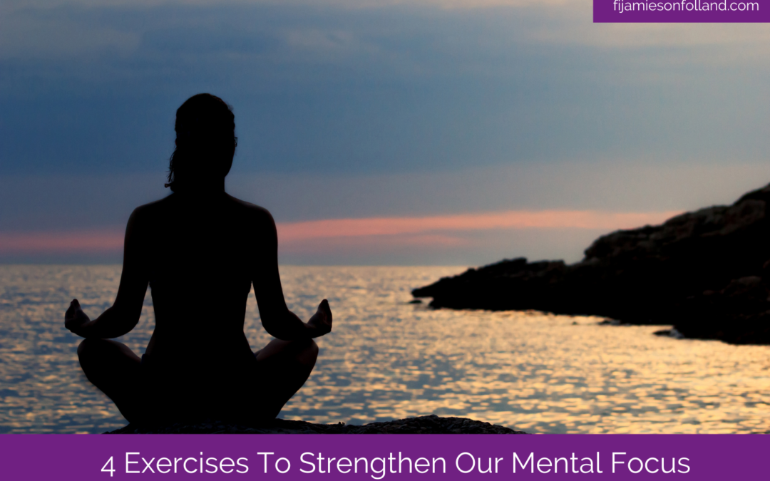 woman meditating near the body of water