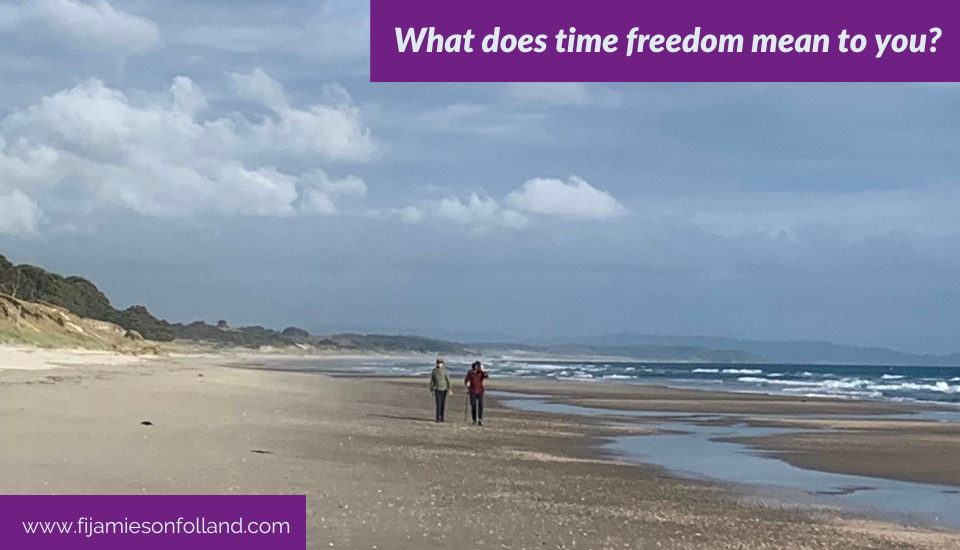 two people walking on the seashore enjoying time freedom